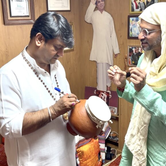 Felly Gomes of Live Happy NGO, Global Messenger of Indian Heritage, received a blessing from Guruji in London.